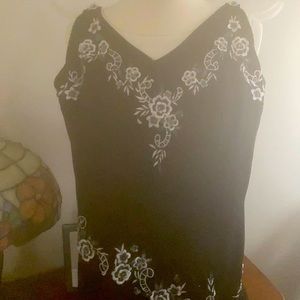 Cocktail dress with beading and flower appliqué drop waist handkerchief bottom